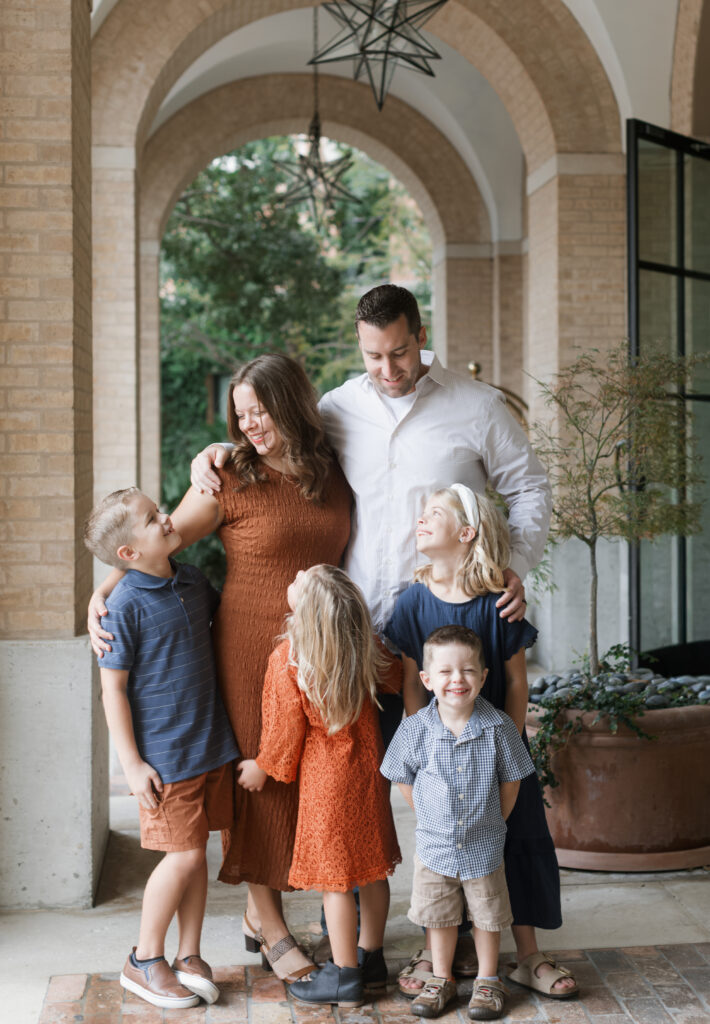 Lovely family embraces in the arches while taking Family Photos at the Pearl