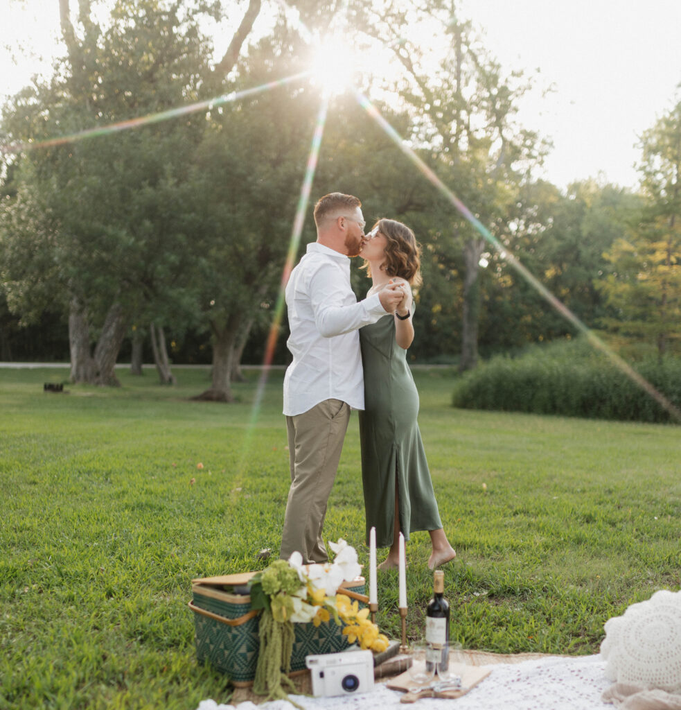 Starburst photo taken of a kissing couple during a spring in a park
